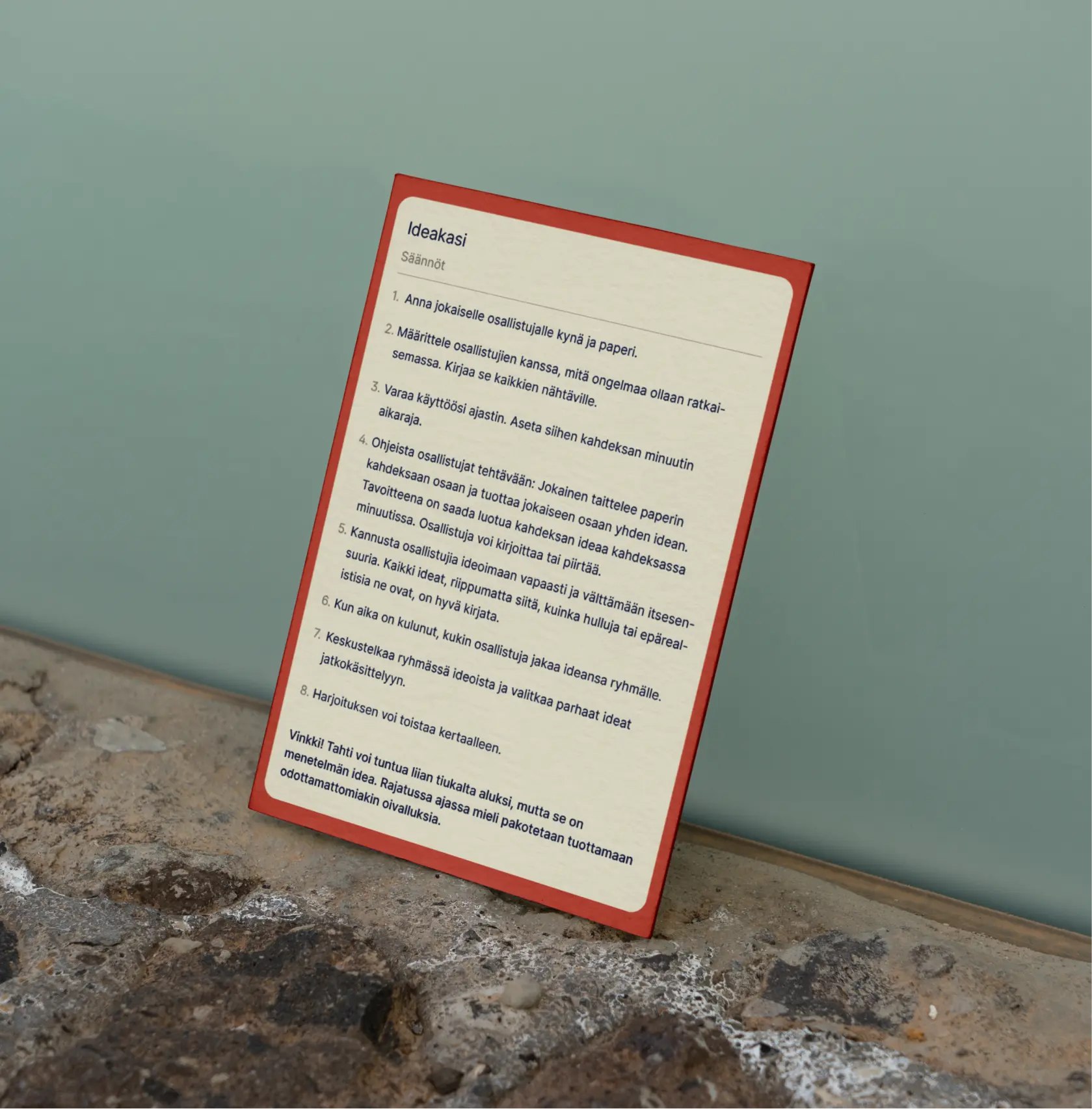 Idea-kasi ohjeista kehyksessä seinää vasten